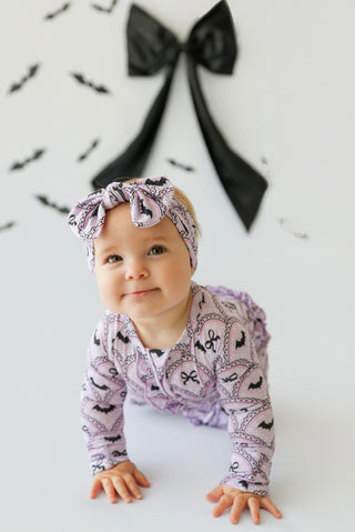 BOWTIFUL BATS DREAM RUFFLE ROMPER