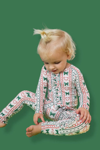 WRAPPED IN JOY DREAM RUFFLE ROMPER