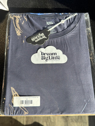 Navy blue men's t-shirt with "Dream Big Little" cloud logo and text design on chest, packaged in plastic.
